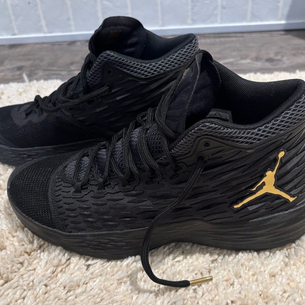 Jordan Black and Gold Sneakers